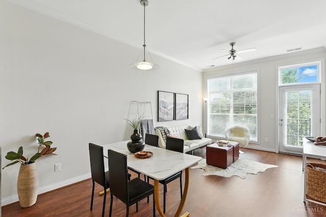 252 Stetson St Unit 403, Cincinnati, OH 45219 - dining room with crown molding, wood finished floors, and a ceiling fan