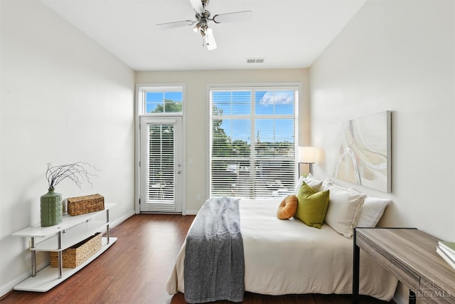 252 Stetson St Unit 403, Cincinnati, OH 45219 - bedroom with access to outside, dark wood finished floors, and a ceiling fan