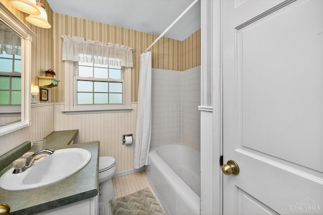 10410 Maria Ave, Springfield Twp, OH 45231 - bathroom with wallpapered walls, tile patterned flooring, vanity, shower / bathtub combination with curtain, and a wainscoted wall