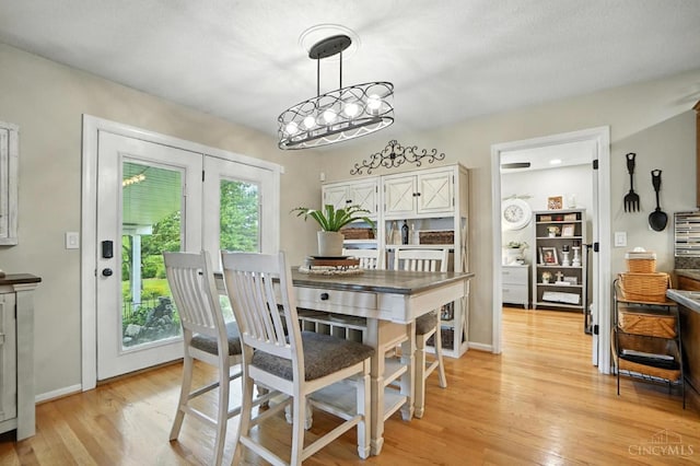 1751 Tatum Ln, Hamilton, OH 45013 - dining space featuring light wood-style floors and a chandelier