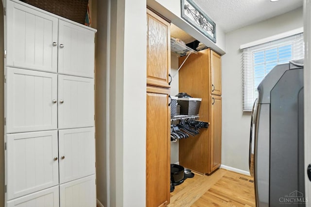 1751 Tatum Ln, Hamilton, OH 45013 - corridor featuring light wood-style floors and a textured ceiling