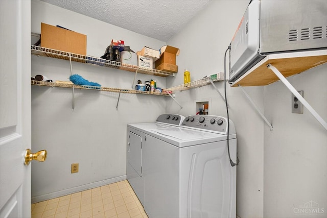 90 Lorelei Dr, Perry Twp, OH 45118 - washroom featuring washing machine and dryer and a textured ceiling