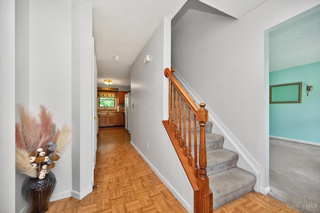 90 Lorelei Dr, Perry Twp, OH 45118 - stairs with a textured ceiling and baseboards