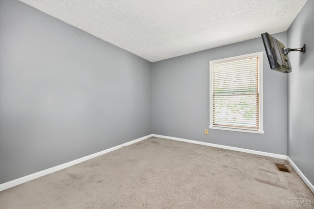 90 Lorelei Dr, Perry Twp, OH 45118 - carpeted empty room featuring a textured ceiling and baseboards