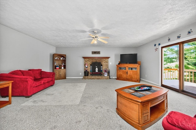 90 Lorelei Dr, Perry Twp, OH 45118 - living area with a ceiling fan, carpet floors, a textured ceiling, and a fireplace