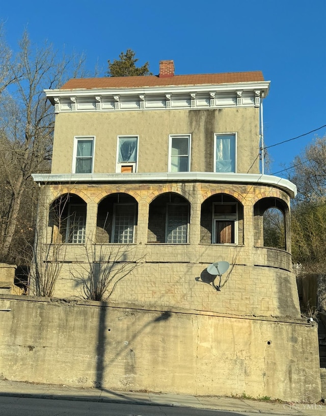 1708 Harrison Ave, Cincinnati, OH 45214 - italianate house with stucco siding and a chimney