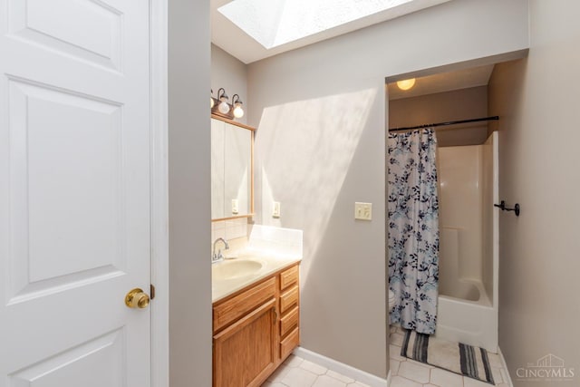 207 Valhalla Cv, Lakengren, OH 45320 - bathroom featuring a skylight, vanity, tile patterned floors, and shower / bathtub combination with curtain