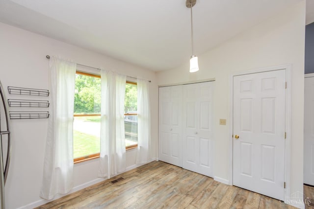 207 Valhalla Cv, Lakengren, OH 45320 - unfurnished bedroom featuring light wood-style flooring, lofted ceiling, and a closet