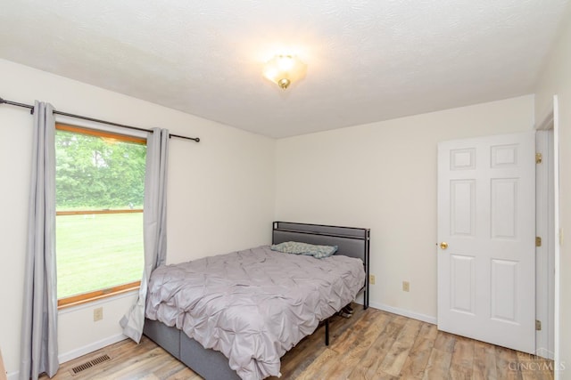 207 Valhalla Cv, Lakengren, OH 45320 - bedroom with wood finished floors and baseboards