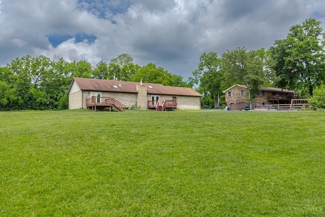 207 Valhalla Cv, Lakengren, OH 45320 - view of grassy yard featuring a deck