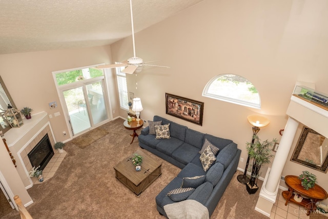 4247 Fieldsedge Dr, Mason, OH 45040 - living room featuring carpet flooring, plenty of natural light, a textured ceiling, and a fireplace