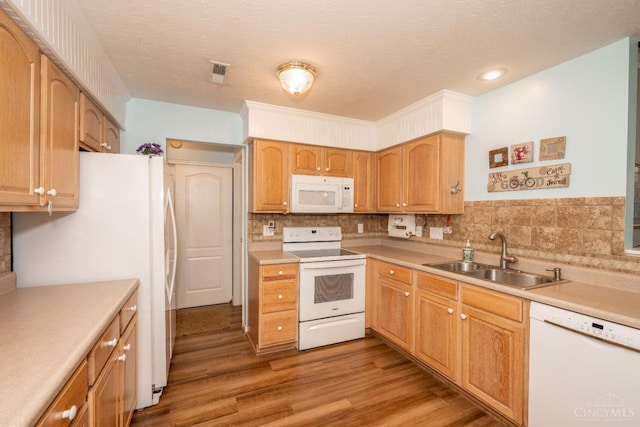 4247 Fieldsedge Dr, Mason, OH 45040 - kitchen with white appliances, light wood-style flooring, light countertops, tasteful backsplash, and a textured ceiling