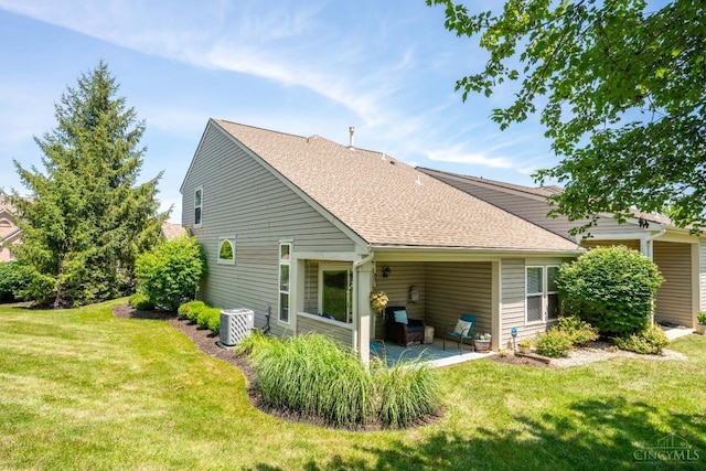 4247 Fieldsedge Dr, Mason, OH 45040 - back of house with a patio, a lawn, and a shingled roof