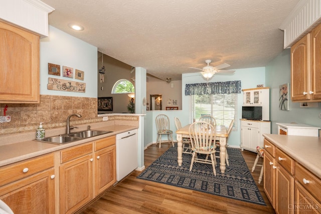 4247 Fieldsedge Dr, Mason, OH 45040 - kitchen with white dishwasher, light countertops, ceiling fan, decorative backsplash, and dark wood-style floors