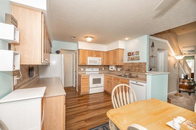 4247 Fieldsedge Dr, Mason, OH 45040 - kitchen with white appliances, light brown cabinetry, light countertops, decorative backsplash, and a textured ceiling