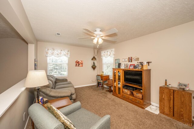 4247 Fieldsedge Dr, Mason, OH 45040 - carpeted living area with ceiling fan and a textured ceiling