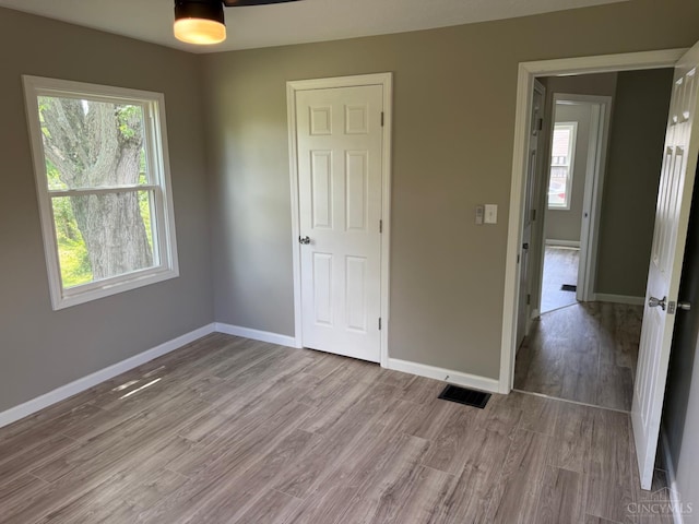 569 Beissinger Rd, Saint Clair Twp, OH 45013 - unfurnished bedroom featuring light wood-style flooring and baseboards