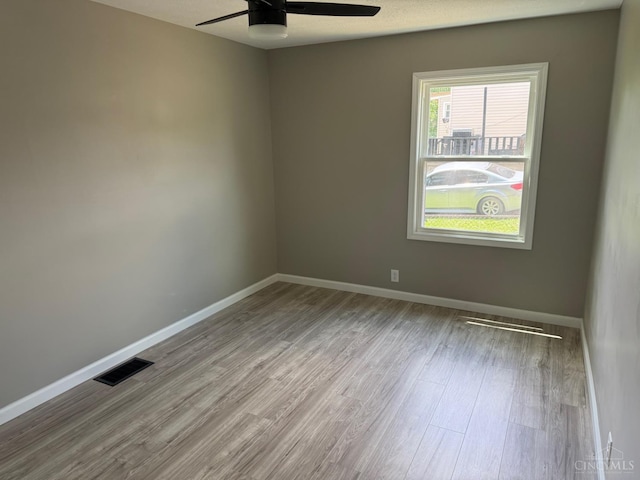 569 Beissinger Rd, Saint Clair Twp, OH 45013 - empty room with a ceiling fan and wood finished floors