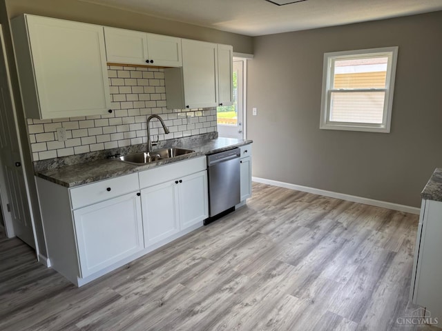 569 Beissinger Rd, Saint Clair Twp, OH 45013 - kitchen featuring dishwasher, dark countertops, backsplash, and plenty of natural light