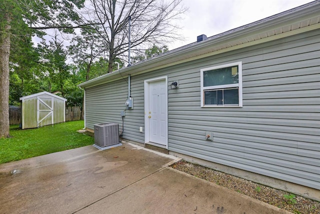 2465 Wilson Ave, Cincinnati, OH 45231 - back of property featuring a patio and a storage unit