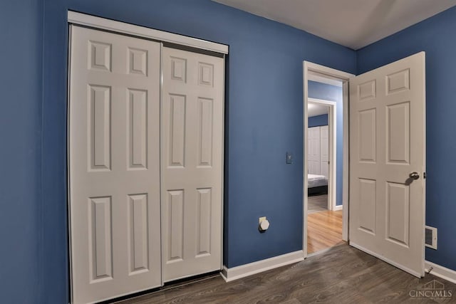 2465 Wilson Ave, Cincinnati, OH 45231 - unfurnished bedroom featuring dark wood-style floors and a closet