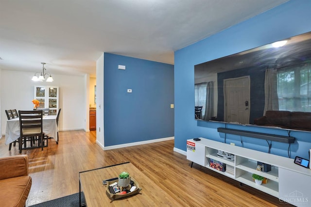 2465 Wilson Ave, Cincinnati, OH 45231 - living room featuring a chandelier and wood finished floors