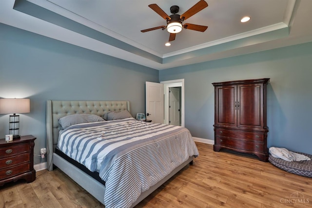 7948 Red Fox Trl, Hamilton Twp, OH 45152 - bedroom with a tray ceiling, light wood-style floors, recessed lighting, crown molding, and ceiling fan