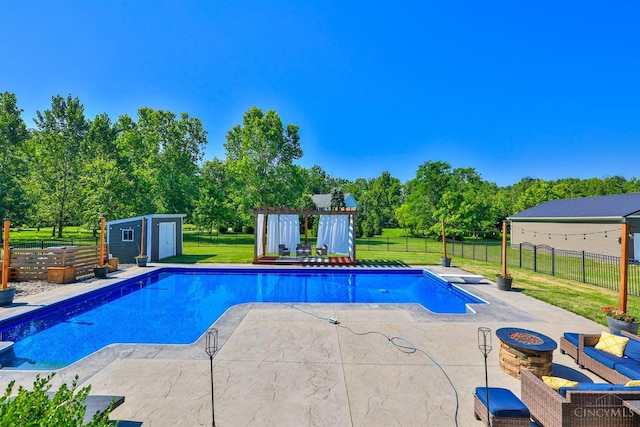7948 Red Fox Trl, Hamilton Twp, OH 45152 - view of pool featuring a patio, an outdoor fire pit, a fenced backyard, and view of wooded area