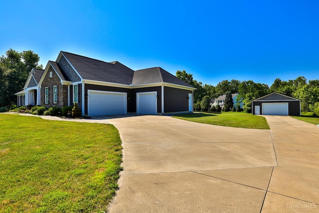 7948 Red Fox Trl, Hamilton Twp, OH 45152 - view of front of house featuring a front lawn, driveway, and an outdoor structure