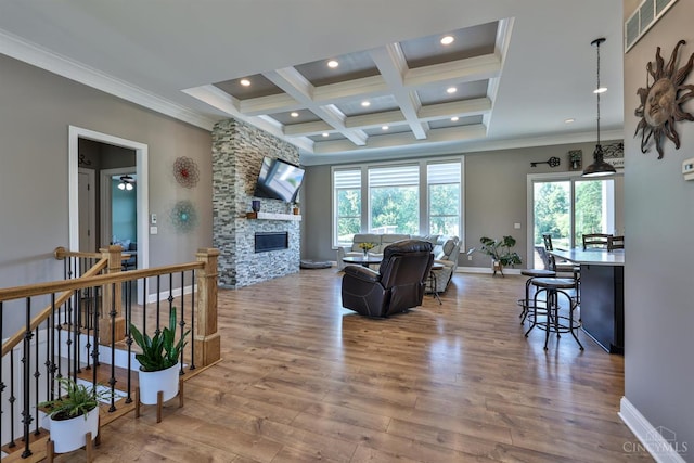 7948 Red Fox Trl, Hamilton Twp, OH 45152 - living area featuring ornamental molding, healthy amount of natural light, coffered ceiling, wood finished floors, and beamed ceiling