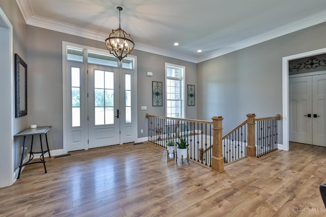 7948 Red Fox Trl, Hamilton Twp, OH 45152 - entrance foyer featuring a chandelier, wood finished floors, crown molding, and recessed lighting