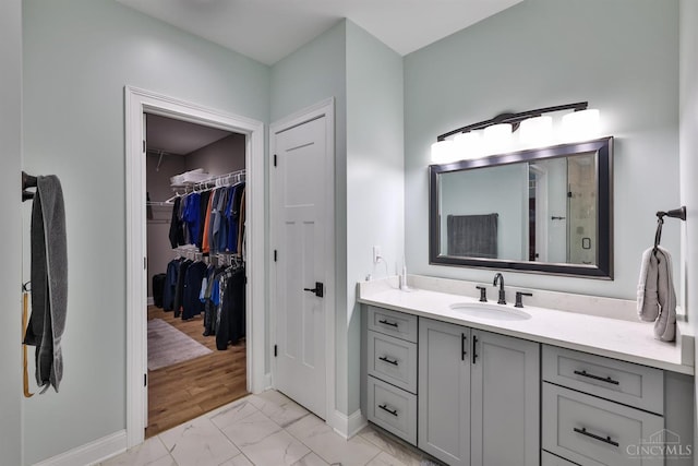 7948 Red Fox Trl, Hamilton Twp, OH 45152 - full bathroom featuring marble finish floors, vanity, and a walk in closet