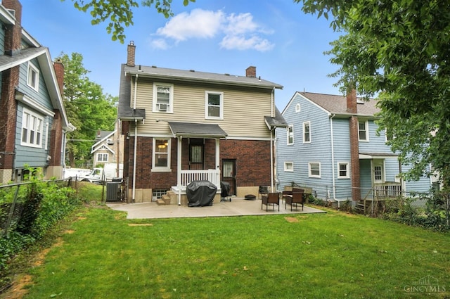3462 Wabash Ave, Cincinnati, OH 45207 - rear view of property with a patio area, a fenced backyard, brick siding, and a chimney