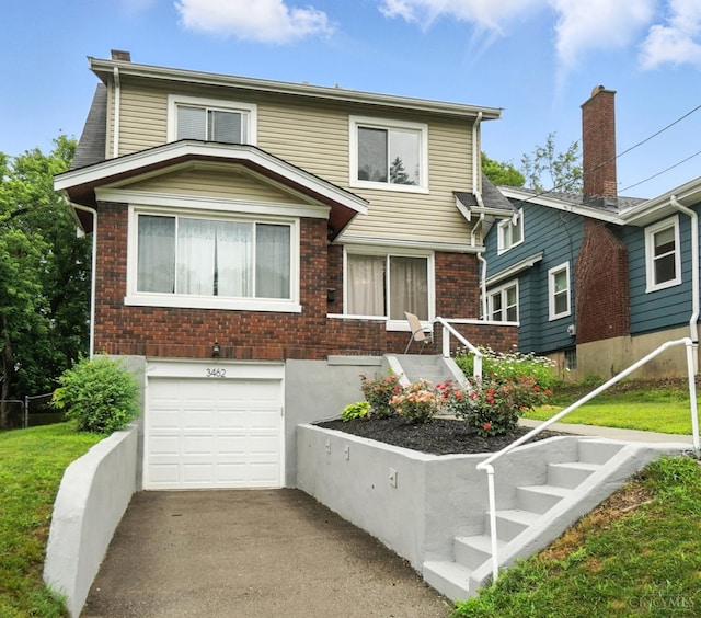 3462 Wabash Ave, Cincinnati, OH 45207 - traditional home with a garage, brick siding, and concrete driveway
