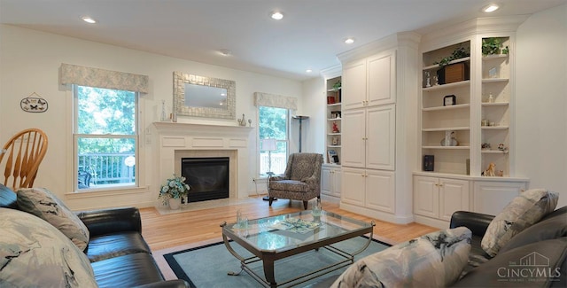 3893 Jocelyn Dr, Fairfield Twp, OH 45011 - living room with light wood finished floors, a fireplace with flush hearth, and recessed lighting