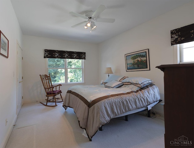 3893 Jocelyn Dr, Fairfield Twp, OH 45011 - bedroom featuring light carpet, multiple windows, and a ceiling fan