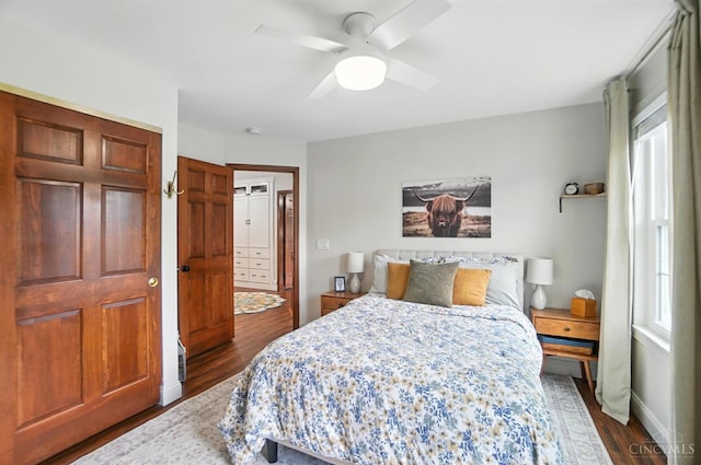 8608 Sunmont Dr, Anderson Twp, OH 45255 - bedroom with dark wood-style floors and ceiling fan