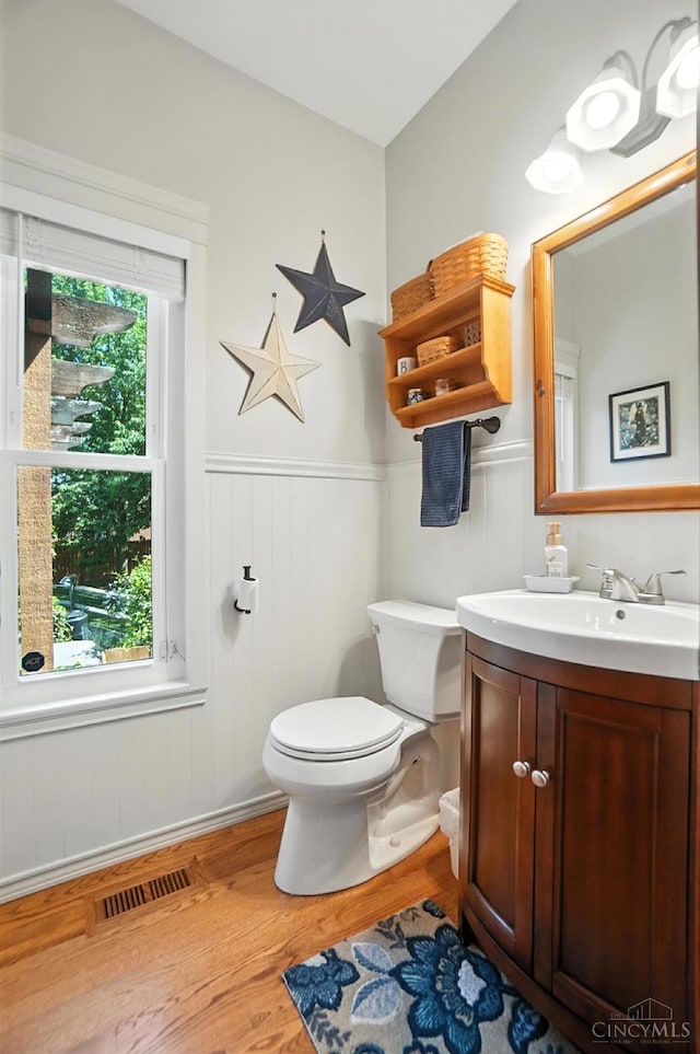 8608 Sunmont Dr, Anderson Twp, OH 45255 - half bath with wood finished floors, vanity, and wainscoting