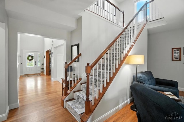 8608 Sunmont Dr, Anderson Twp, OH 45255 - stairway with wood finished floors and a towering ceiling