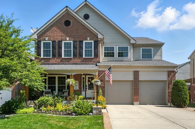 8608 Sunmont Dr, Anderson Twp, OH 45255 - view of front of home featuring driveway, a garage, brick siding, and a porch