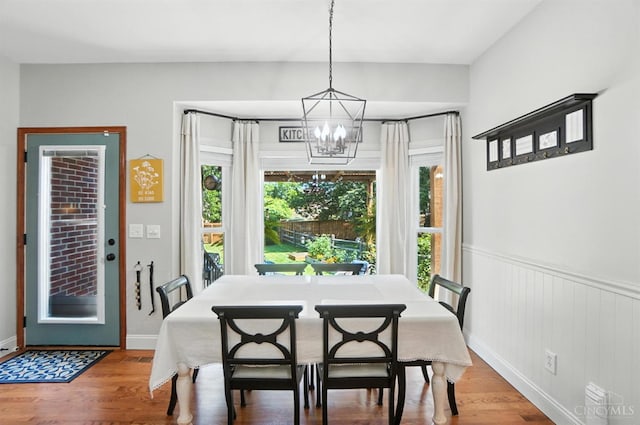 8608 Sunmont Dr, Anderson Twp, OH 45255 - dining room featuring a chandelier, wood finished floors, and wainscoting