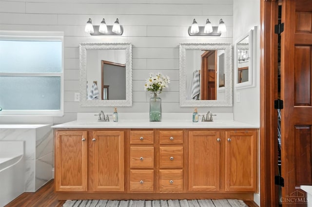 8608 Sunmont Dr, Anderson Twp, OH 45255 - full bathroom with double vanity and wood finished floors