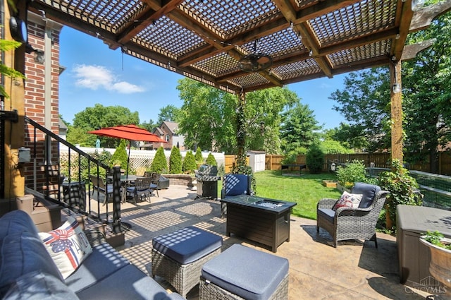 8608 Sunmont Dr, Anderson Twp, OH 45255 - fenced backyard featuring a storage shed, an outdoor living space with a fire pit, a patio, a pergola, and stairs