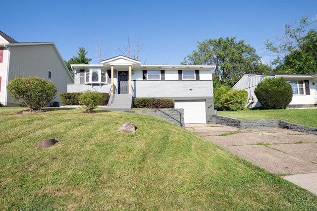 8784 Pippin Rd, Colerain Twp, OH 45251 - ranch-style home with driveway, a garage, and a front lawn