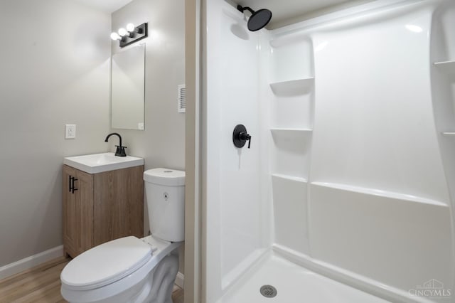 8784 Pippin Rd, Colerain Twp, OH 45251 - full bathroom with vanity, a shower, and wood finished floors