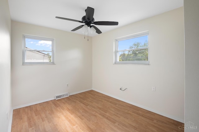 8784 Pippin Rd, Colerain Twp, OH 45251 - empty room with light wood finished floors and a ceiling fan