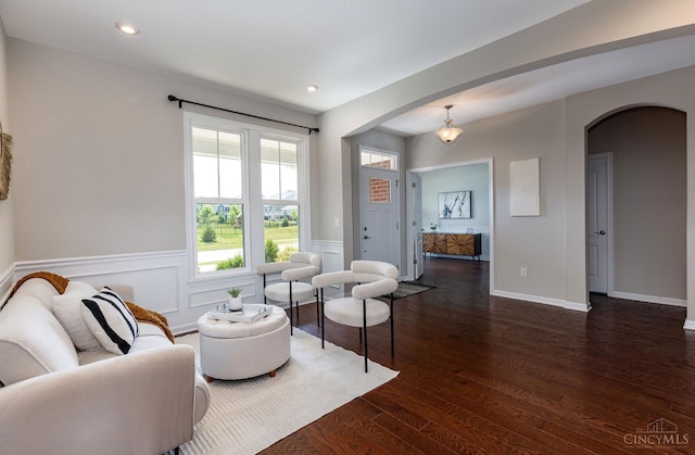 3779 Sturbridge Way, Pierce Twp, OH 45245 - living area with arched walkways, dark wood-style floors, wainscoting, and recessed lighting