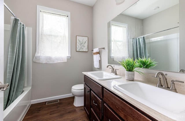 3779 Sturbridge Way, Pierce Twp, OH 45245 - bathroom featuring double vanity, wood finished floors, and shower / tub combo with curtain