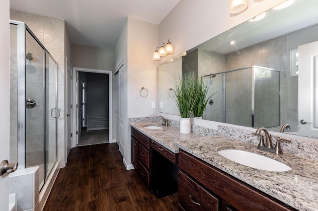 3779 Sturbridge Way, Pierce Twp, OH 45245 - full bathroom featuring wood finished floors, a shower stall, and double vanity