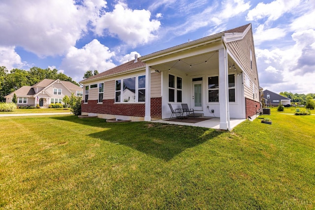 3779 Sturbridge Way, Pierce Twp, OH 45245 - back of house featuring a yard, brick siding, and a patio area